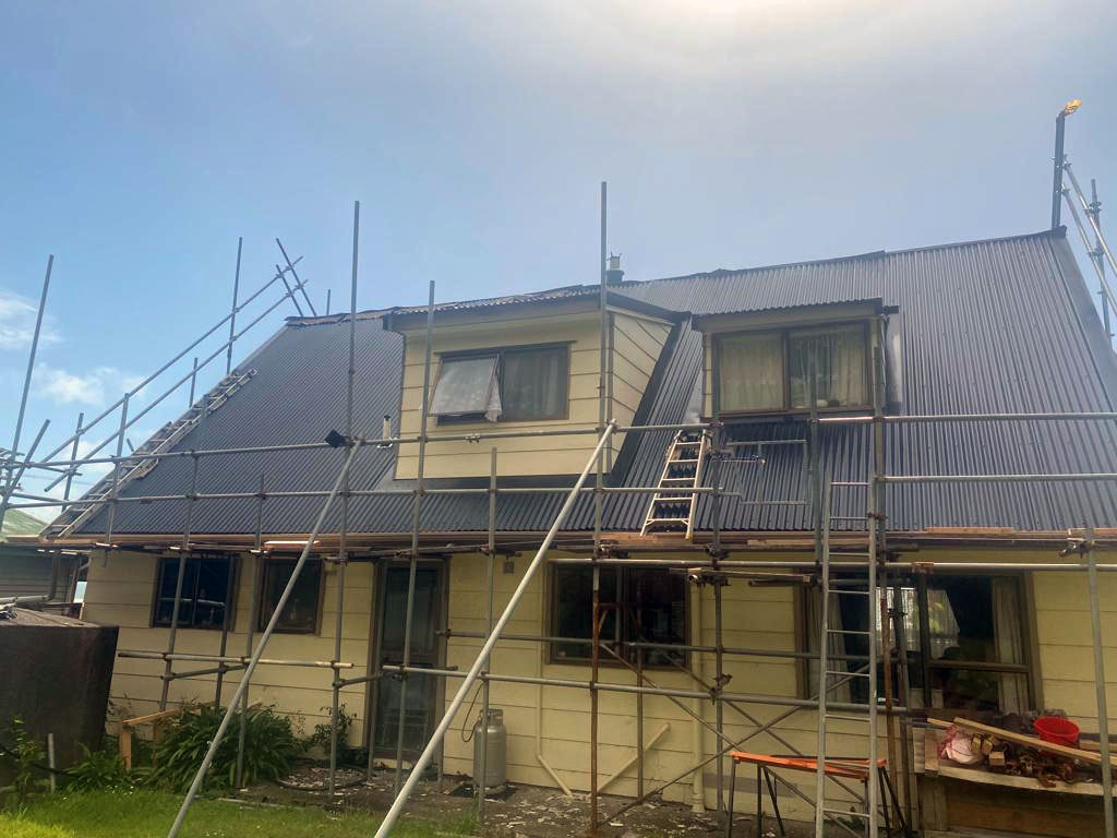 house with scaffolding surrounding it