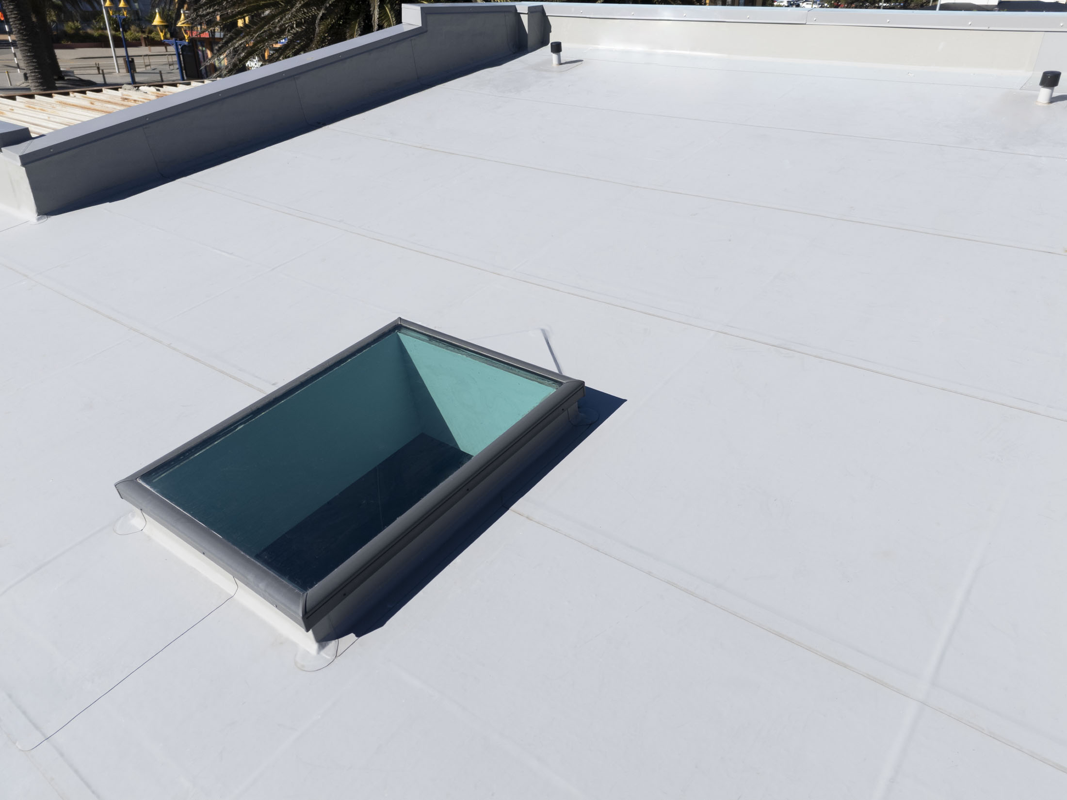 photo of a roof with membrane waterproofing around a sky light window in christchurch